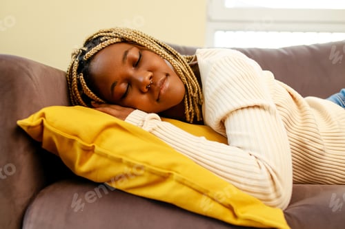 Preview: tired latin hispanic woman taking nap on the sofa during the day