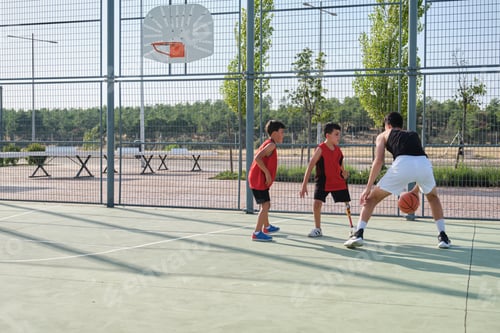 Preview: Three brothers playing basketball, one of them has a leg prosthesis. Siblings playing basket.