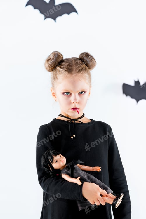 Preview: Little Girl Witch In Black Dress Over Magical Accessories. Halloween, The Studio Evening.