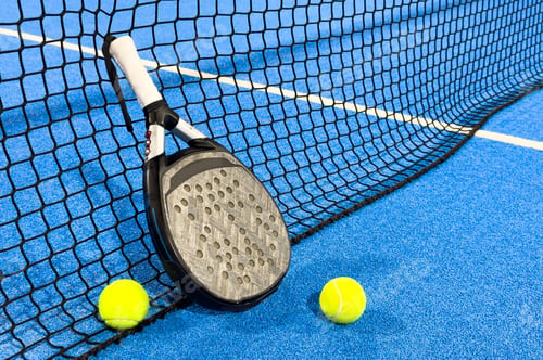 Preview: paddle tennis racket and balls on the blue paddle court