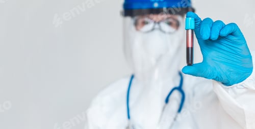 Preview: Female doctor or nurse in protective suit holding a positive blo