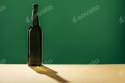 Preview: beer bottle with shadow and copy space isolated on green, st patrick day concept