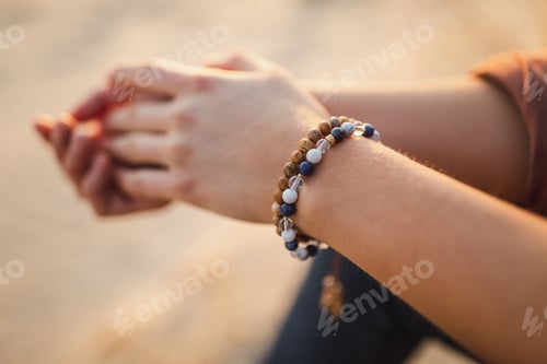 Preview: Close Up Of A Person Wearing A Mala Bracelet