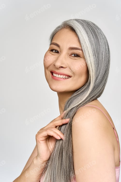 Preview: Senior happy middle aged mature asian woman headshot portrait. Spa advertising.