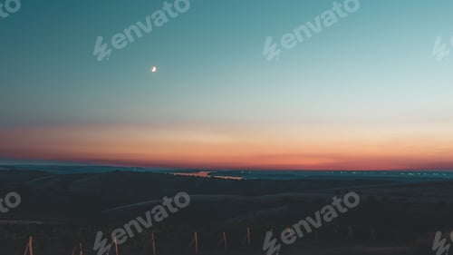 Preview: Scenic view of a golden sunset over the mountains