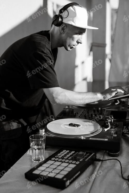 Preview: DJ on stage at a concert mixes tracks