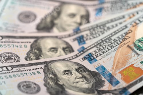 Preview: Top view of 100 dollar bills with the face of Benjamin Franklin