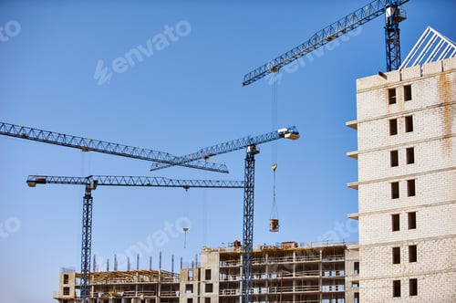 Preview: Construction site with cranes on sky background