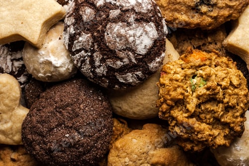 Preview: close up of christmas cookies, with chocolate, ginger, sugar, walnut, powdered sugar on wooden table