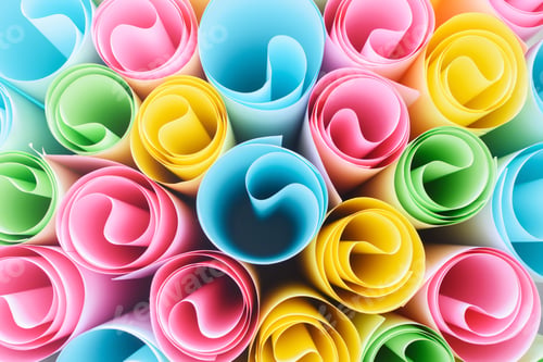 Preview: Colorful paper in rolls. Rainbow abstract background
