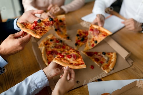 Preview: Colleagues Taking Pizza Slices From Box During Lunch Break In Office, Closeup