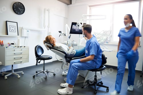 Preview: Blurred view of busy dentists at work