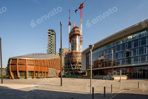 Preview: Modern architecture meets urban construction at a bustling site.