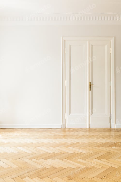 Preview: Copy space on white wall next to door in empty living room inter