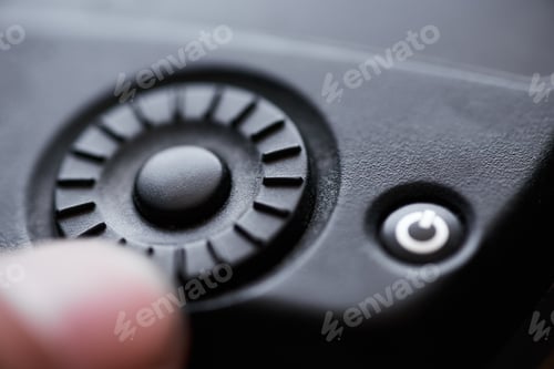 Preview: close up of a control wheel and button