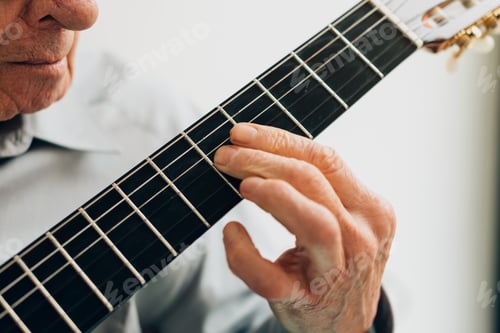 Preview: close up on old man hand playing classical guitar