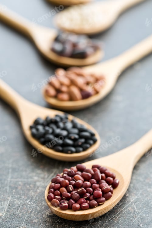 Preview: various legumes in wooden spoons