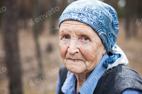 Preview: Portrait of an aged woman smiling outdoors