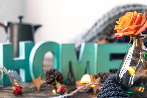 Preview: Cozy background with decorative word Home and home decor details.
