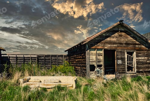 Preview: Wooden house in the landscape at sunset