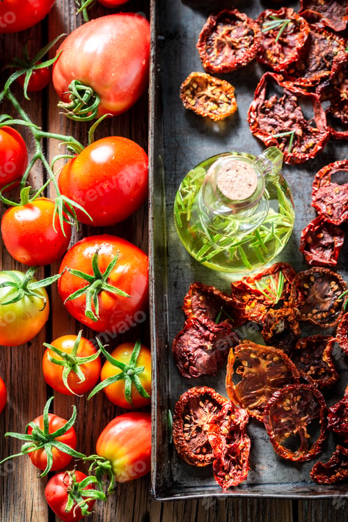 Preview: Homemade and fresh tomatoes dried on baking tray.
