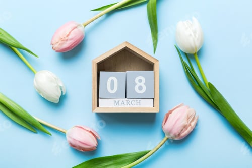 Preview: 8 March, International Women's Day. greeting card design with tulips and calendar top view