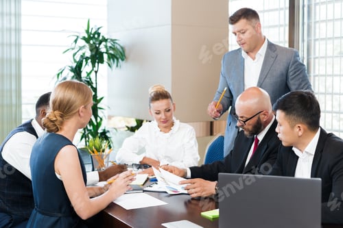 Preview: Business meeting in a modern office with diverse professionals discussing a project