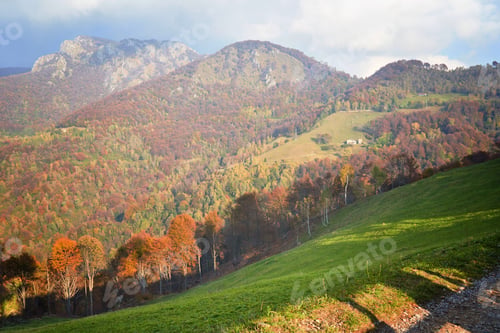 Preview: Picturesque alpine autumn countryside landscape, mountain hills in Lombardy, Italy. Tourist