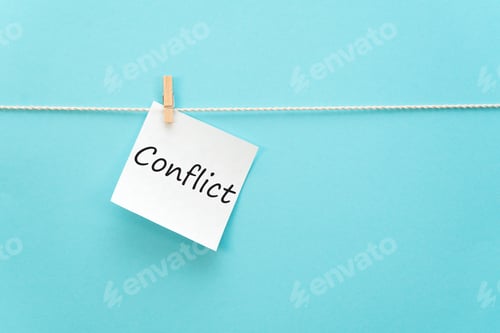 Preview: sticker with the inscription Conflict hangs with a clothespin on a rope on a blue background