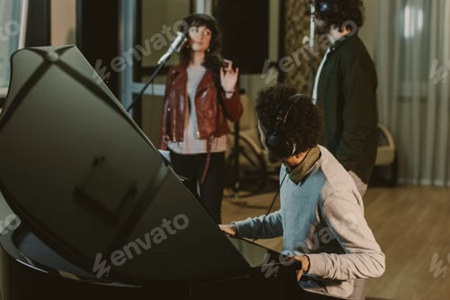 Preview: group of musicians performing song in recording studio