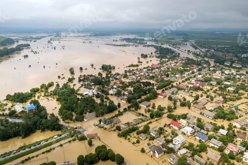 Preview: Aerial view of flooded houses with dirty water of Dnister river in Halych town, western Ukraine.