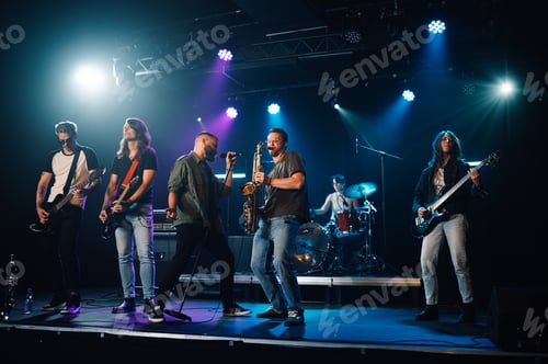 Preview: Music band playing live on stage during a concert under blue and purple lights