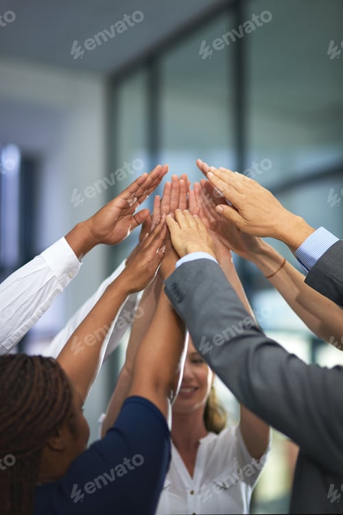 Preview: Go team. Shot of a group of unrecognizable businesspeople with their hands in a huddle.