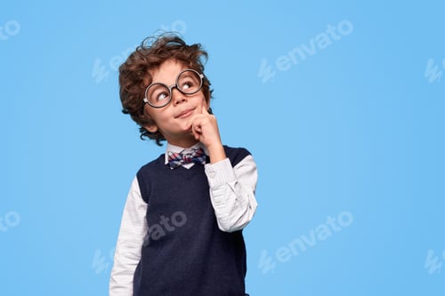 Preview: Thoughtful little genius looking up