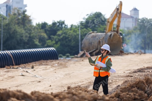 Preview: A female engineer directs work at a construction site.