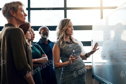 Preview: Shot of a pregnant businesswoman giving a presentation in the boardroom