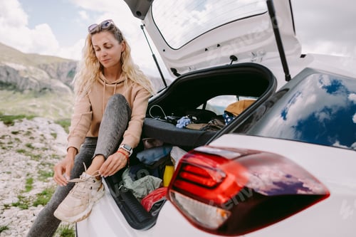 Preview: woman on road trip in mountains