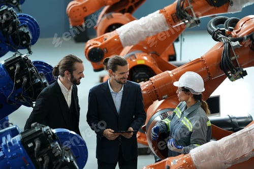 Preview: Robotics engineer working on maintenance of robotic arm in factory warehouse. Business technology.