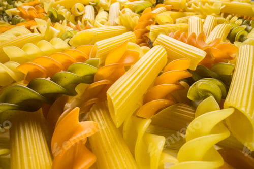Preview: Variety of types and shapes of dry Italian pasta close-up. Food and traditional cuisine