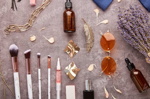 Preview: Aesthetic feminine make up set. Dropper bottles, brushes, sunglasses, jewelry, cosmetics