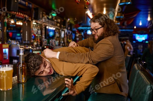 Preview: Aggressive man pulling guy on bar counter