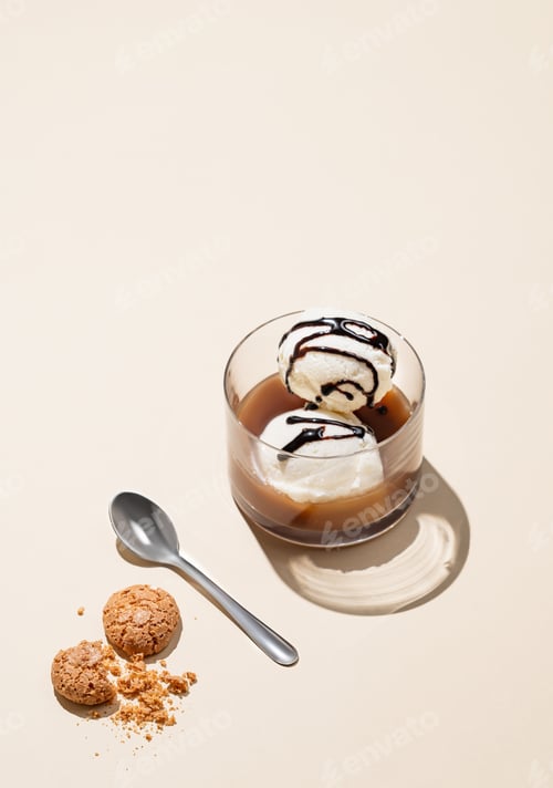 Preview: Affogato coffee with vanilla ice cream scoops with chocolate and espresso in a glass