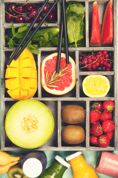 Preview: Fresh juices or smoothies with fruits and vegetables in wooden t