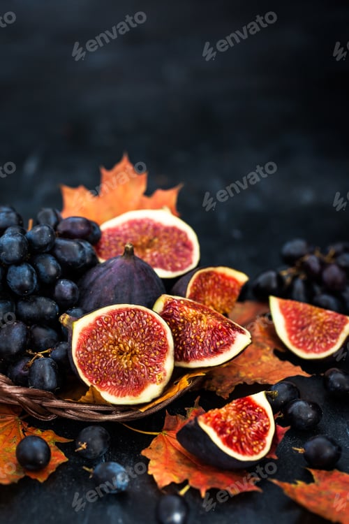 Preview: Dark Ripe Figs and Grapes on Autumn Leaves