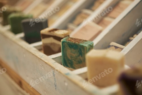 Preview: Homemade soaps. Variety of colorful handmade soap bars on wooden background