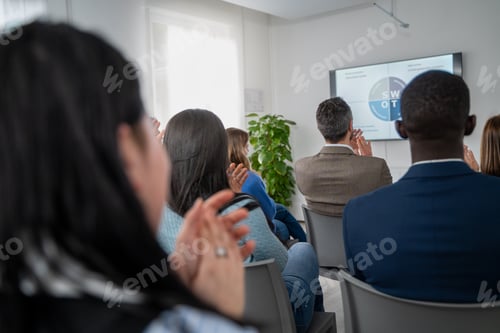 Preview: Diverse business team meeting presentation conference room professional development training seminar