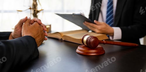 Preview: Lawyer or judge reading the law in client's trial at the lawyer's office, litigation consultation id