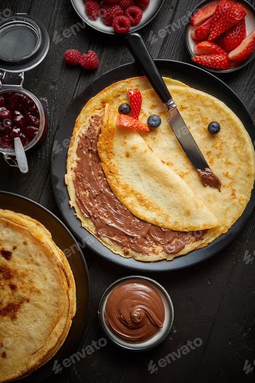 Preview: Delicious chocolate homemade pancakes on black ceramic plate