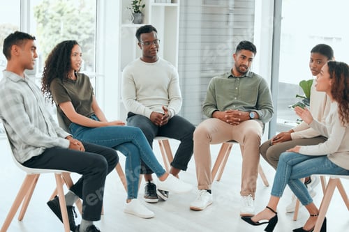 Preview: Shot of a diverse group of people sitting together and talking during group therapy