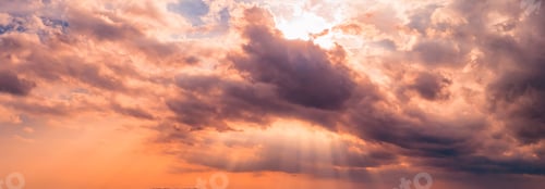 Preview: Orange Cloudscape at Sunrise with Crepuscular Rays